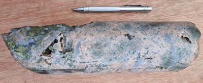 Figure 2 - 229m – Dacite porphyry breccia: intense potassic alteration (pink) mostly as halos around type A veinlets, quartz with chalcopyrite, molybdenite veinlets, disseminated molybdenite (grey speck) and chalcopyrite. (CNW Group/Libero Copper & Gold Corporation.)