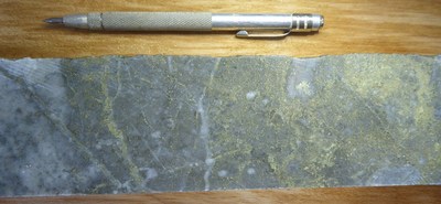 Photo 3: Assay interval returned 1.0 CuEq (0.92% Cu and 0.024% Mo) over 1.5m from 876.4m -877.9m.
Quartz=sericite-pyrite overprinting potassic altered micro-breccia with pyrite and chalcopyrite stringer mineralization. (CNW Group/Libero Copper & Gold Corporation.)